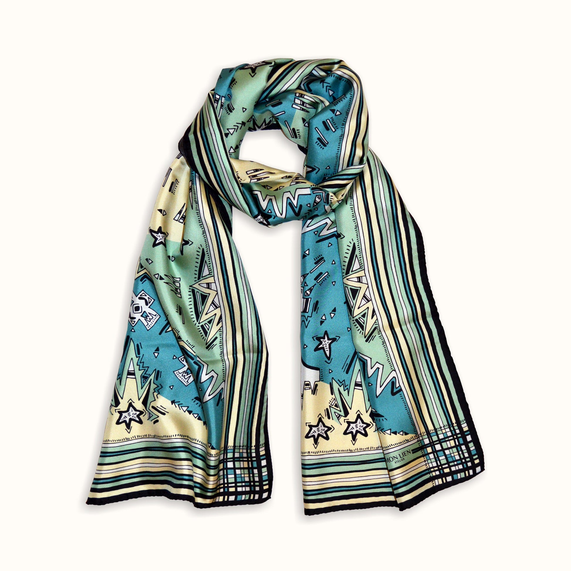 lungo foulard rettangolare piegato in cerchio con disegni stampati ottanio avorio nero per proteggere dal vento con stile